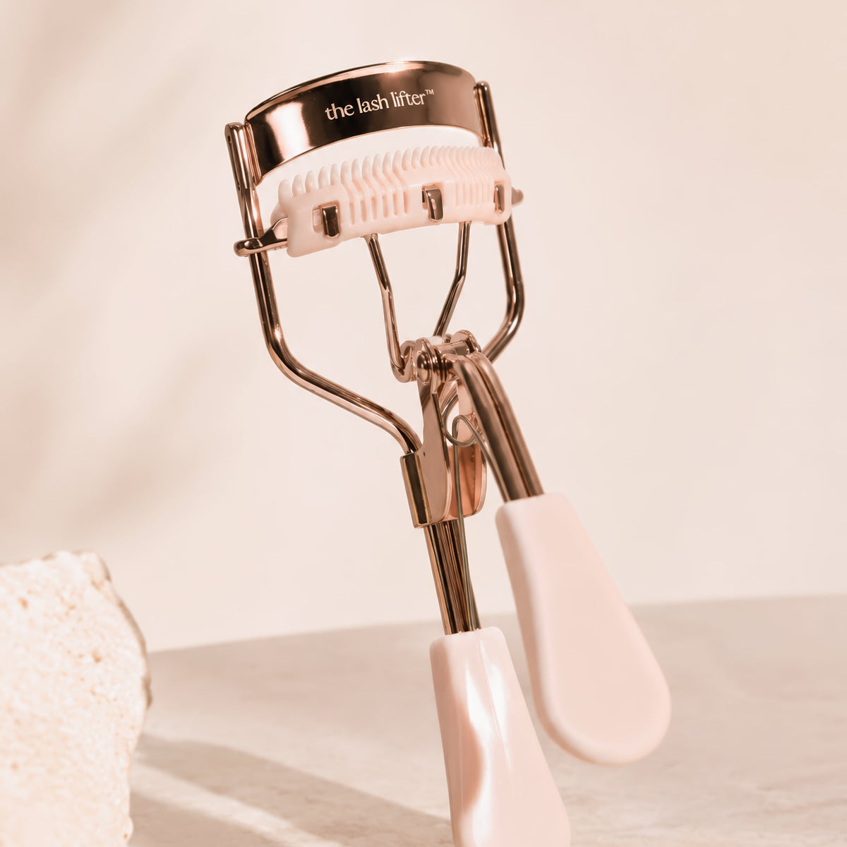 The lash lifter standing on warm stone